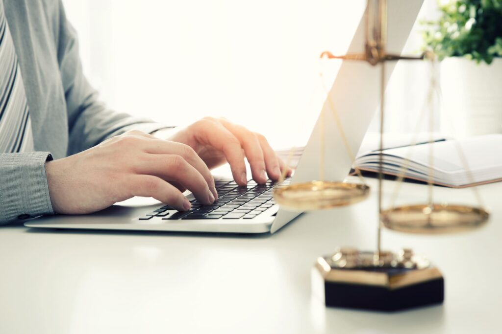 Lawyer using computer to complete legal project